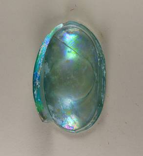 Piece of archaeological glass with iridescence