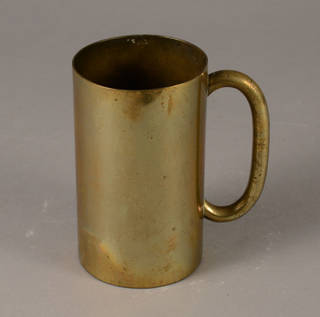Brass cup with fingerprints