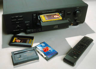 DCC digital compact cassette player with DCC and case in foreground