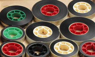 Newsreel films on inert plastic cores