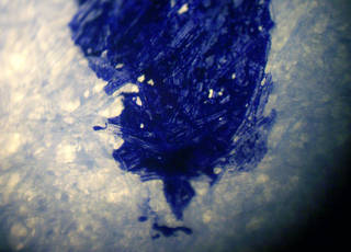 Blue ink in paper fibers