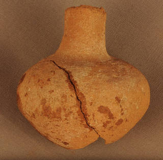 Ceramic object with visible adhesive around a previous repair