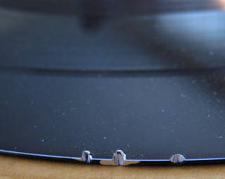 Laminate disc with exposed aluminum core