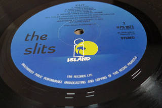 Vinyl record label clearly glued to surface